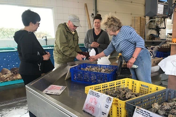 people in a fish market in Normandy