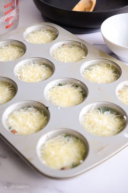 egg whites and swiss cheese in muffin tin