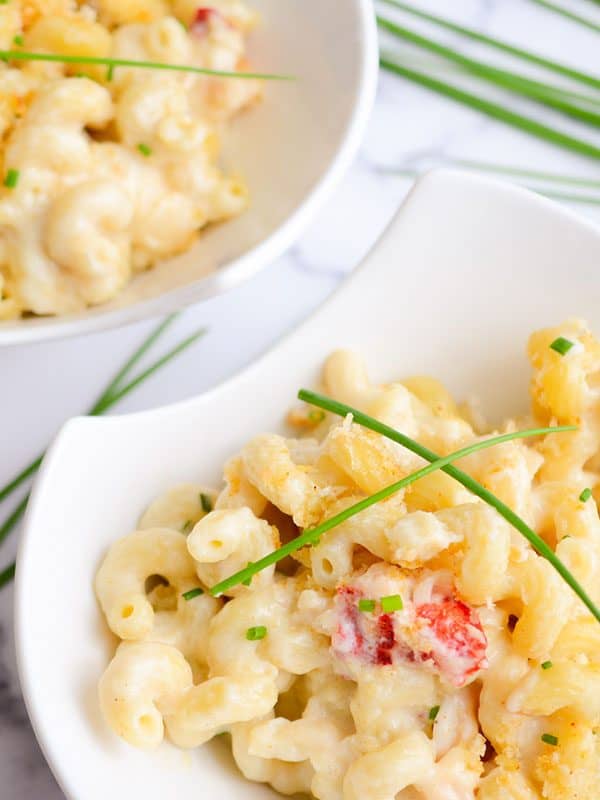 two bowls of lobster mac and cheese with chives