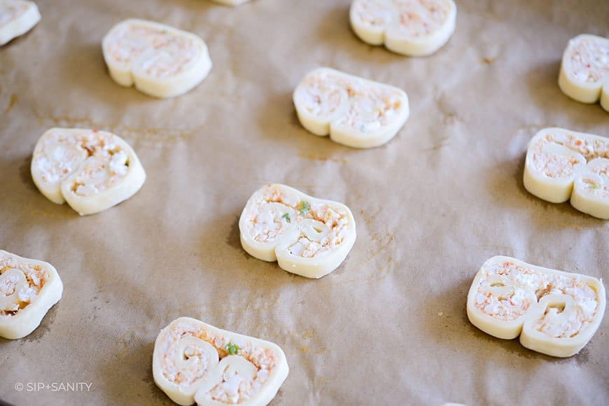 crab and goat cheese palmiers place on a sheet pan