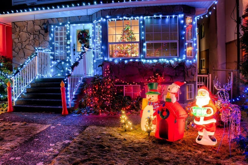 holiday lights and decorations on the outside of a house