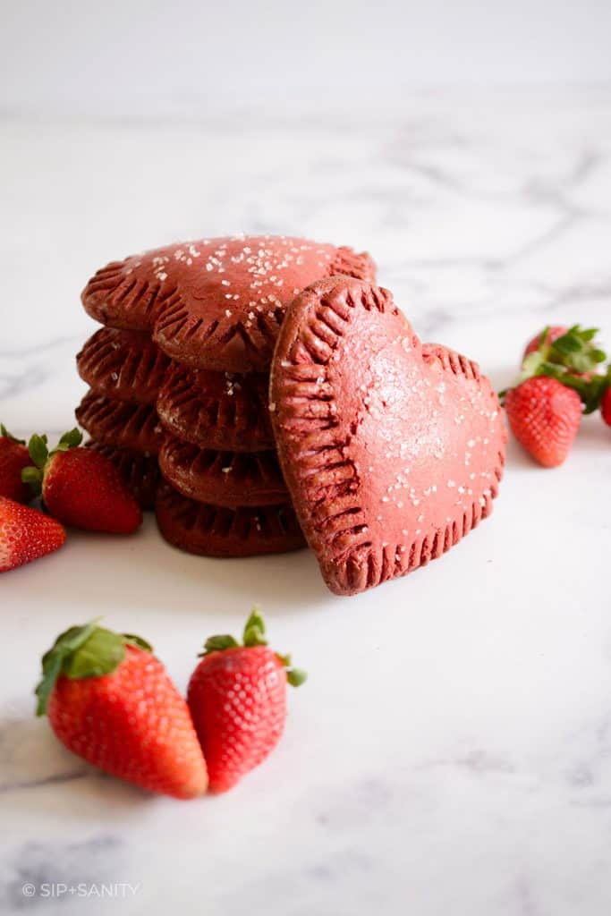 a stack of red velvet pop tarts and fresh strawberries