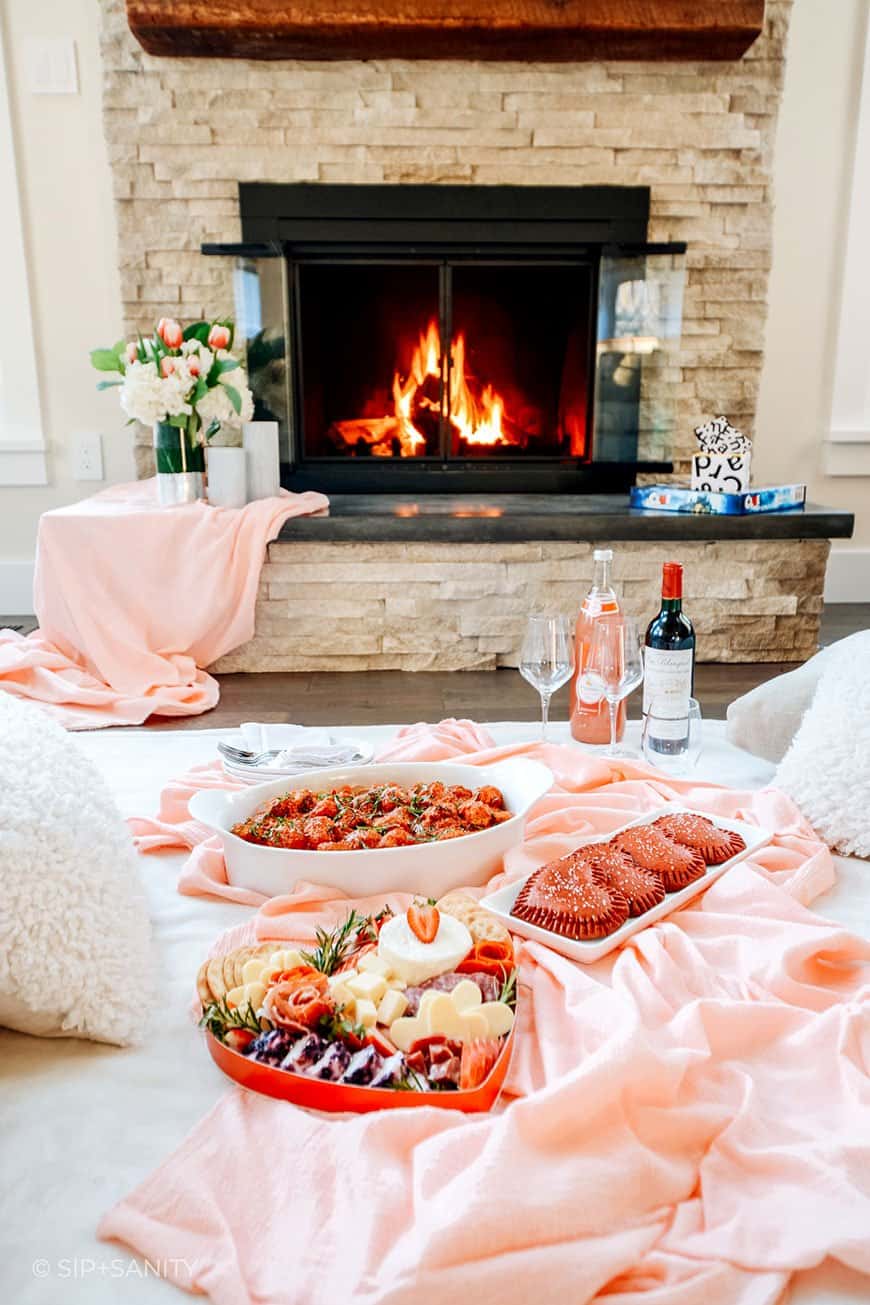 valentine's day indoor picnic by the fireplace