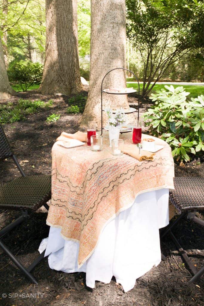 a garden table set for afternoon tea