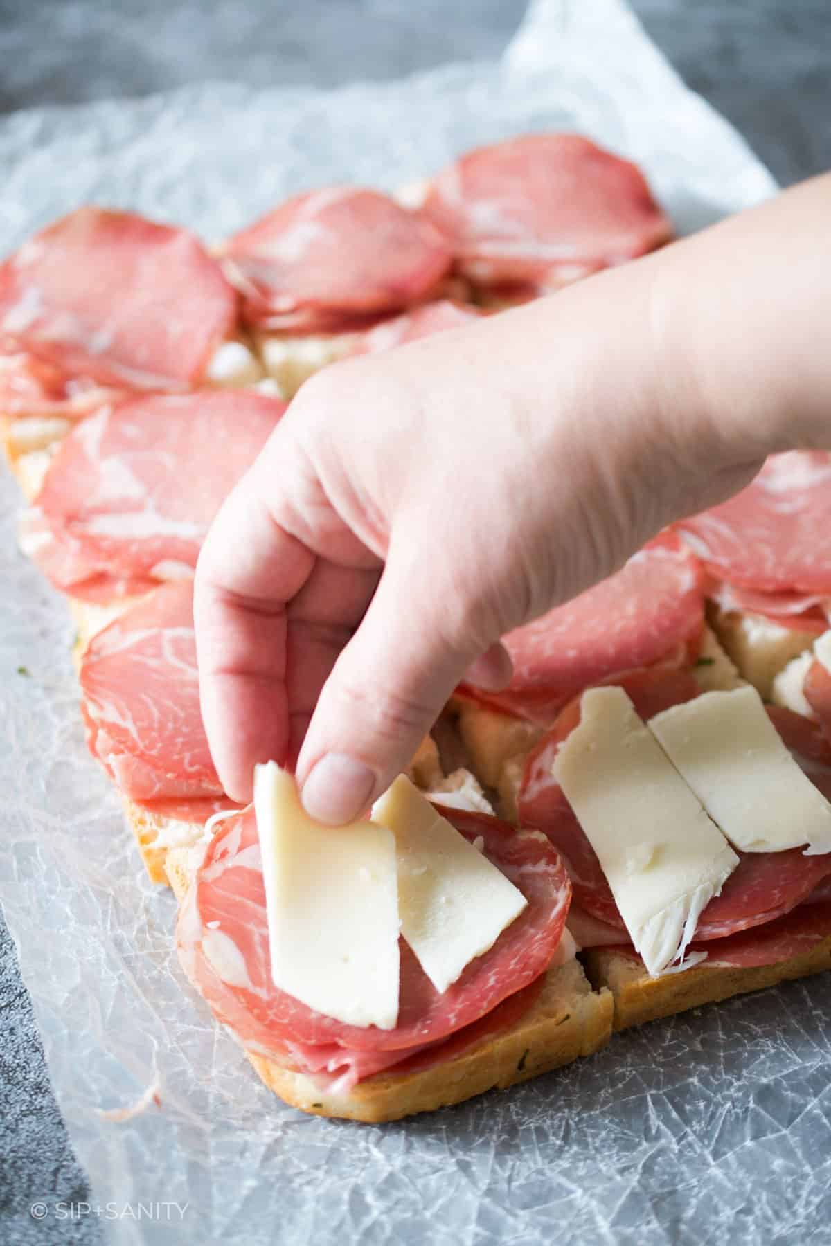 adding cheese to sliders