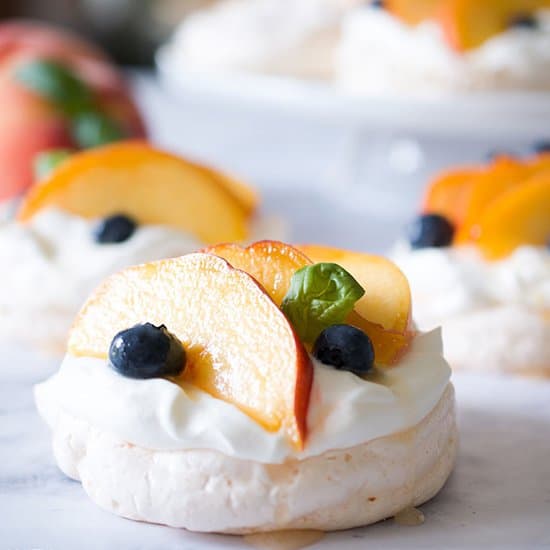 mini fresh peach pavlova with fuzzy navel syrup by sip and sanity