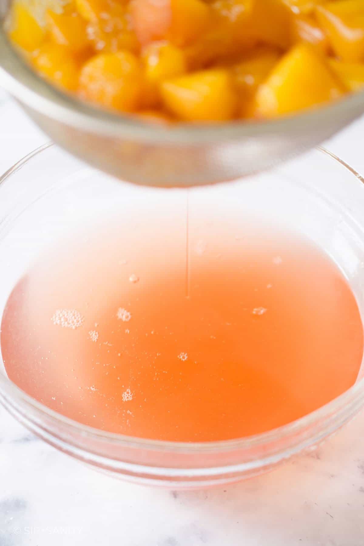 fuzzy navel syrup being drained