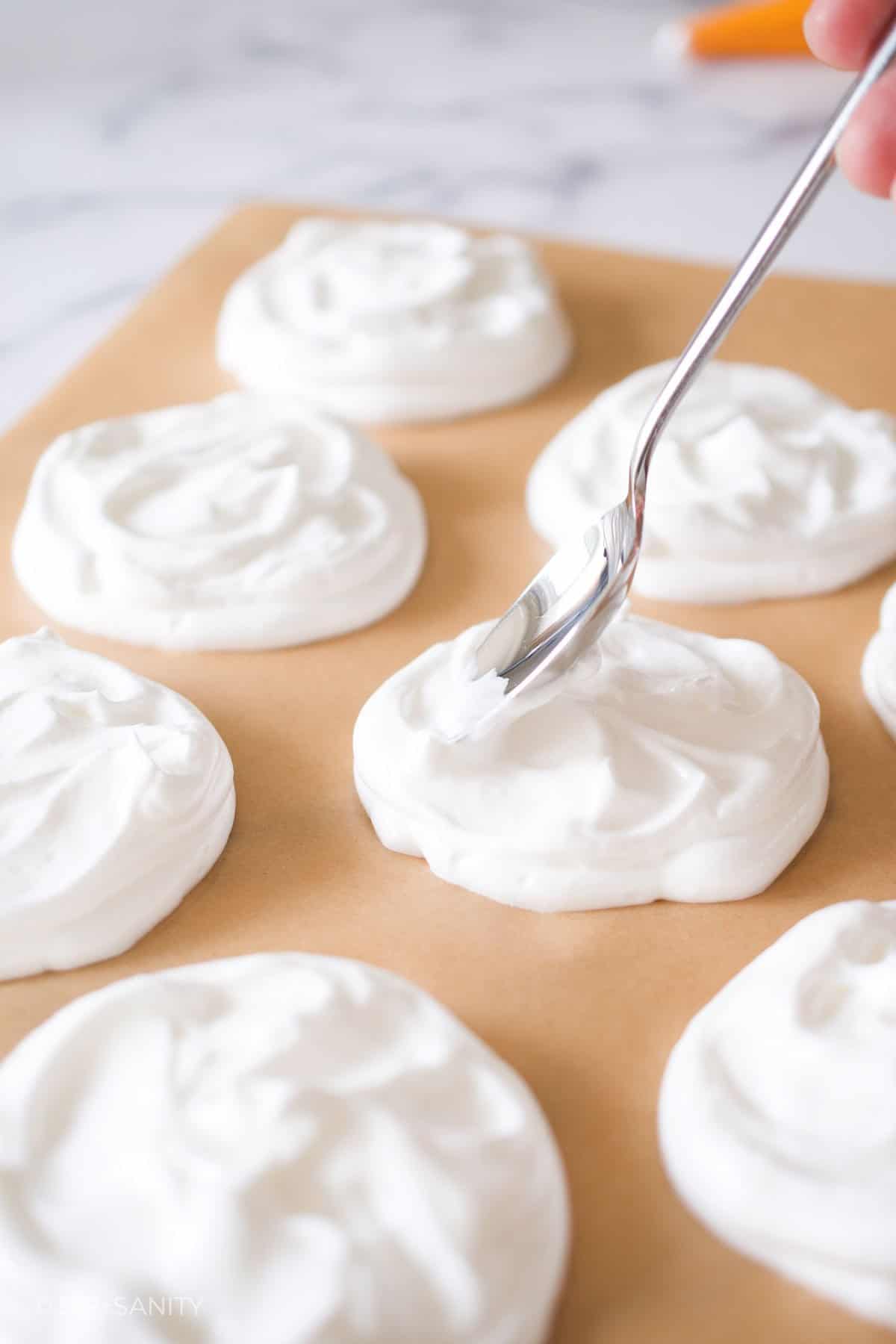 smoothing meringue with a spoon