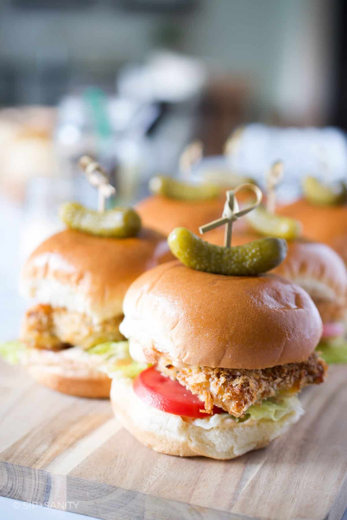 oven fried chicken sliders on a board