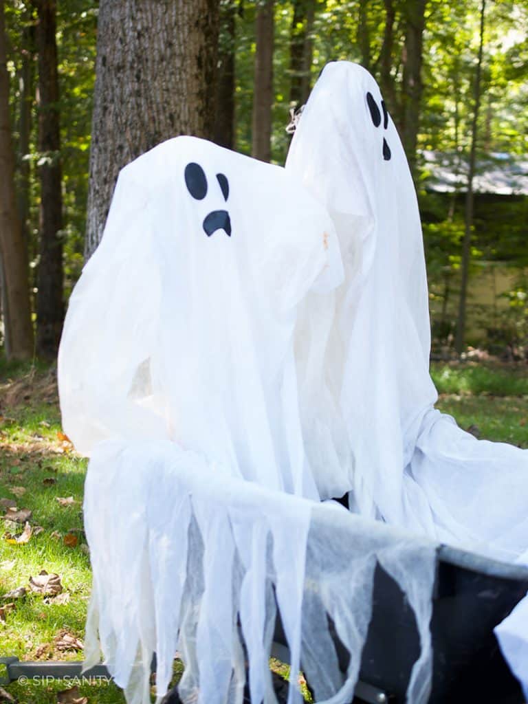 two halloween ghosts attached to a wagon