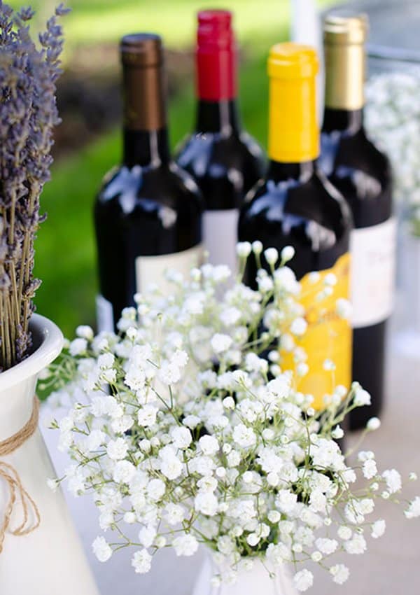 baby's breath and wine bottles