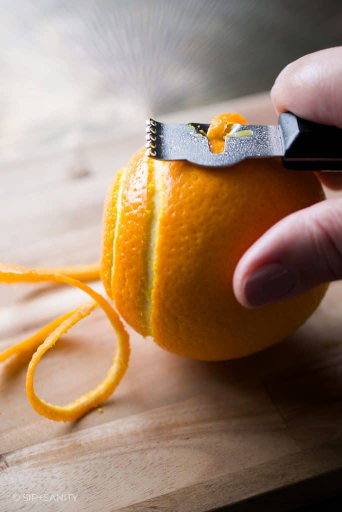 peeling an orange with a channel knife