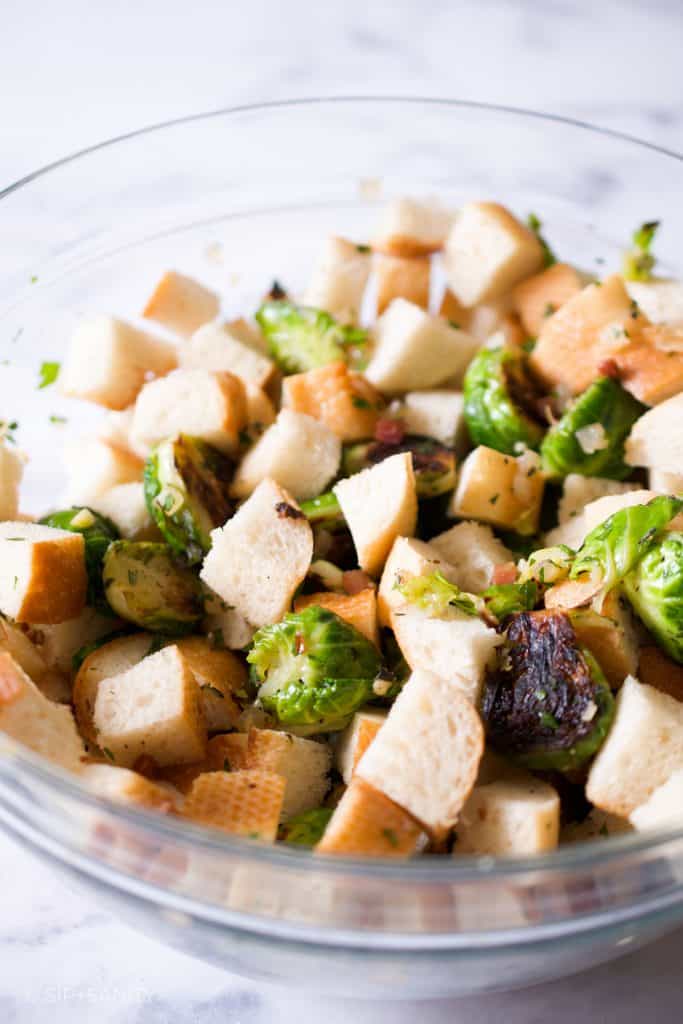 bowl of brussels sprouts and toasted baguette cubes