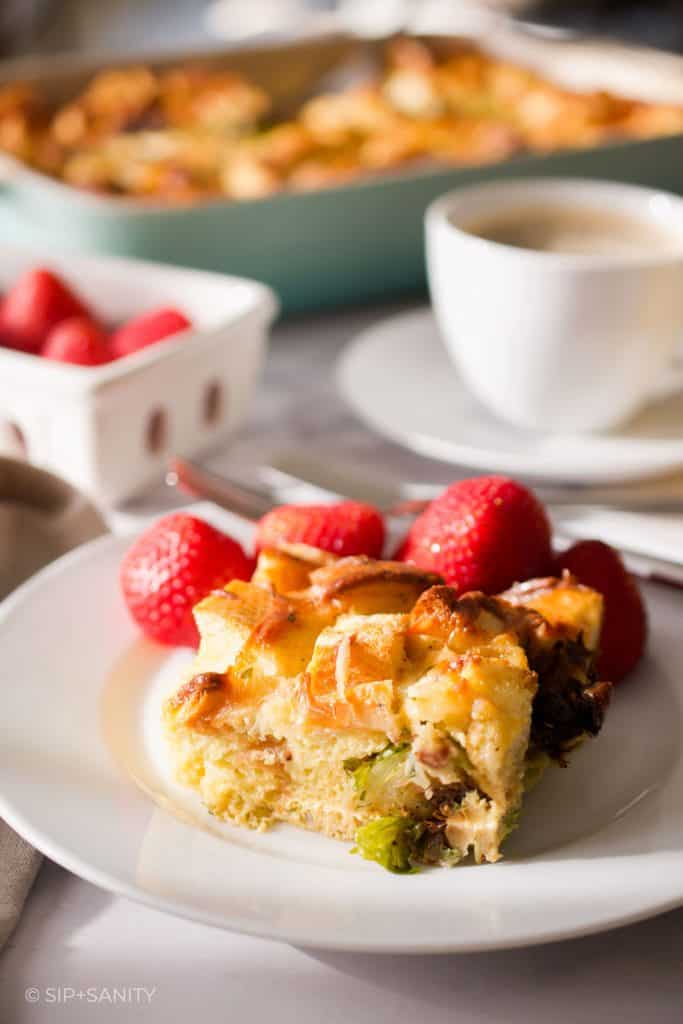 breakfast strata on a plate with strawberries