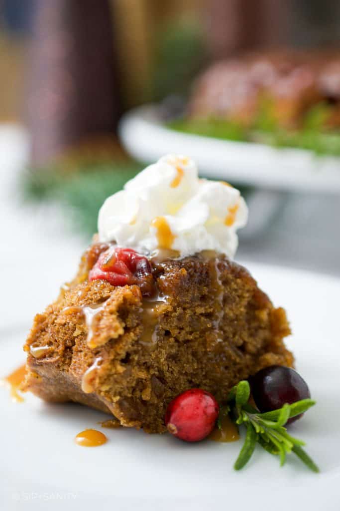 slice of cranberry ginger bundt cake with whipped cream