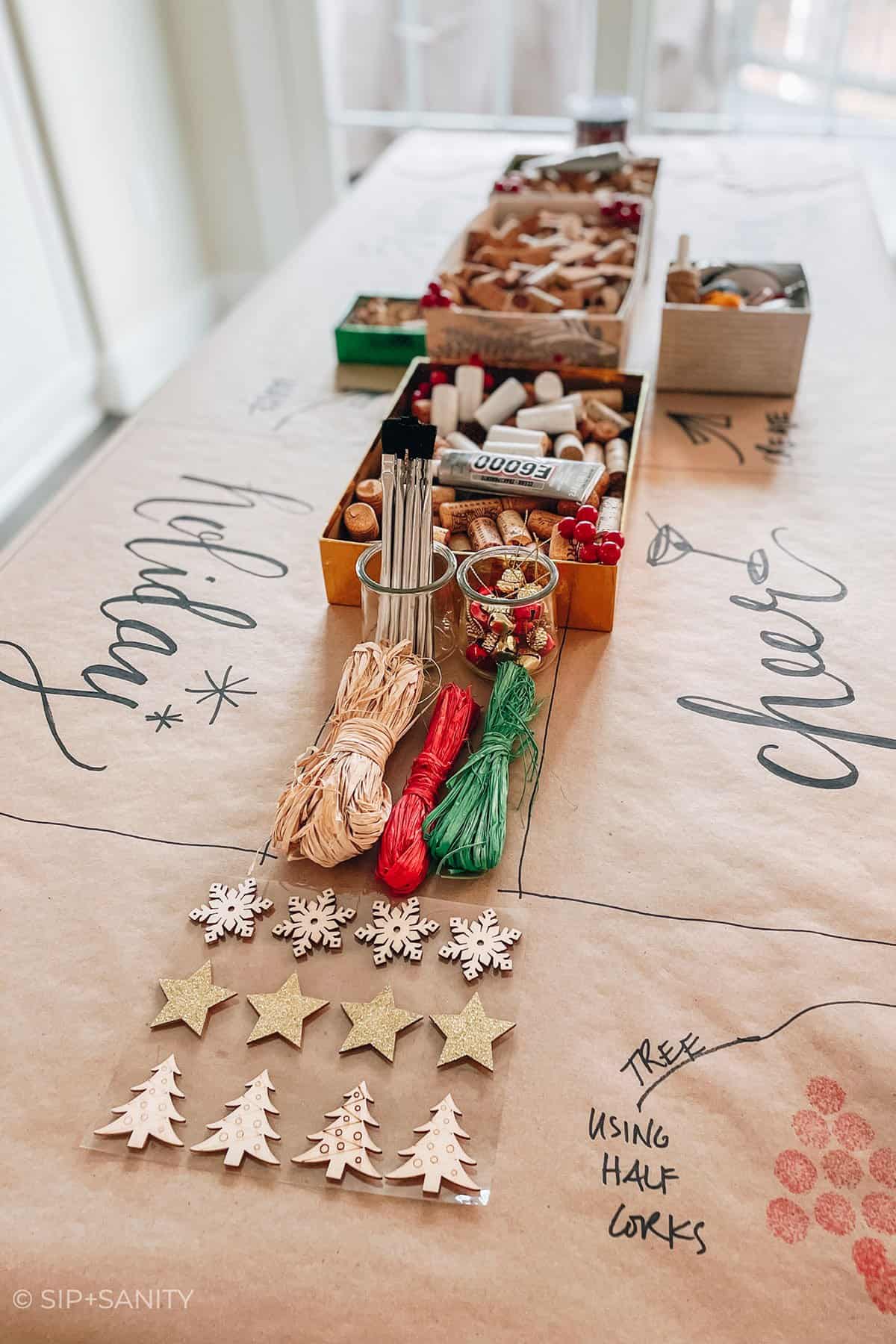a holiday wine cork crafting table set up