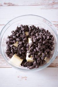 Cubed butter and chocolate chips in a bowl.