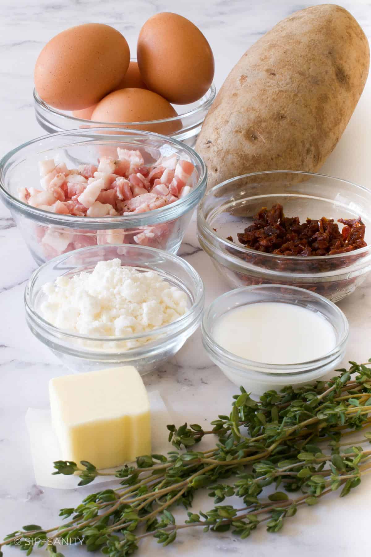 Raw ingredients for baked eggs with goat cheese.