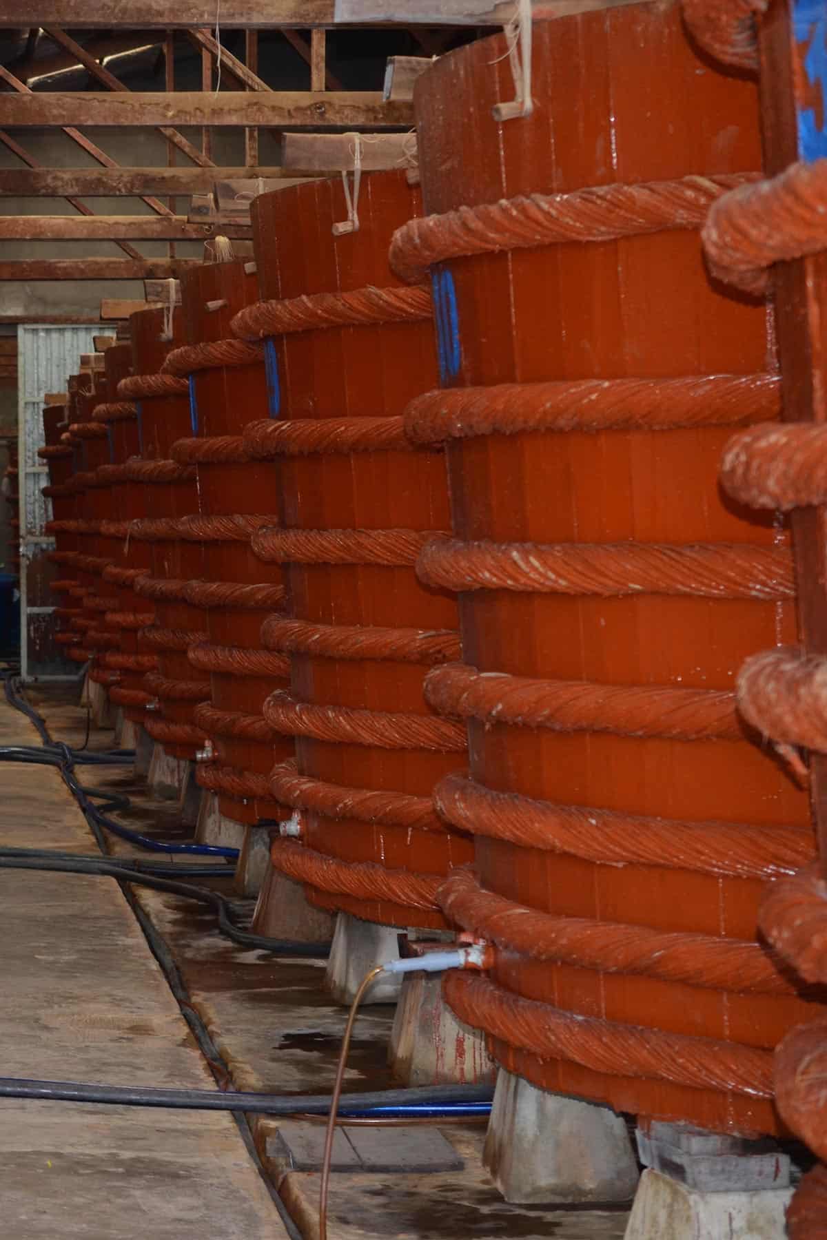 Clear glass jar of Vietnamese dipping sauce next to a squeezed half of lime.