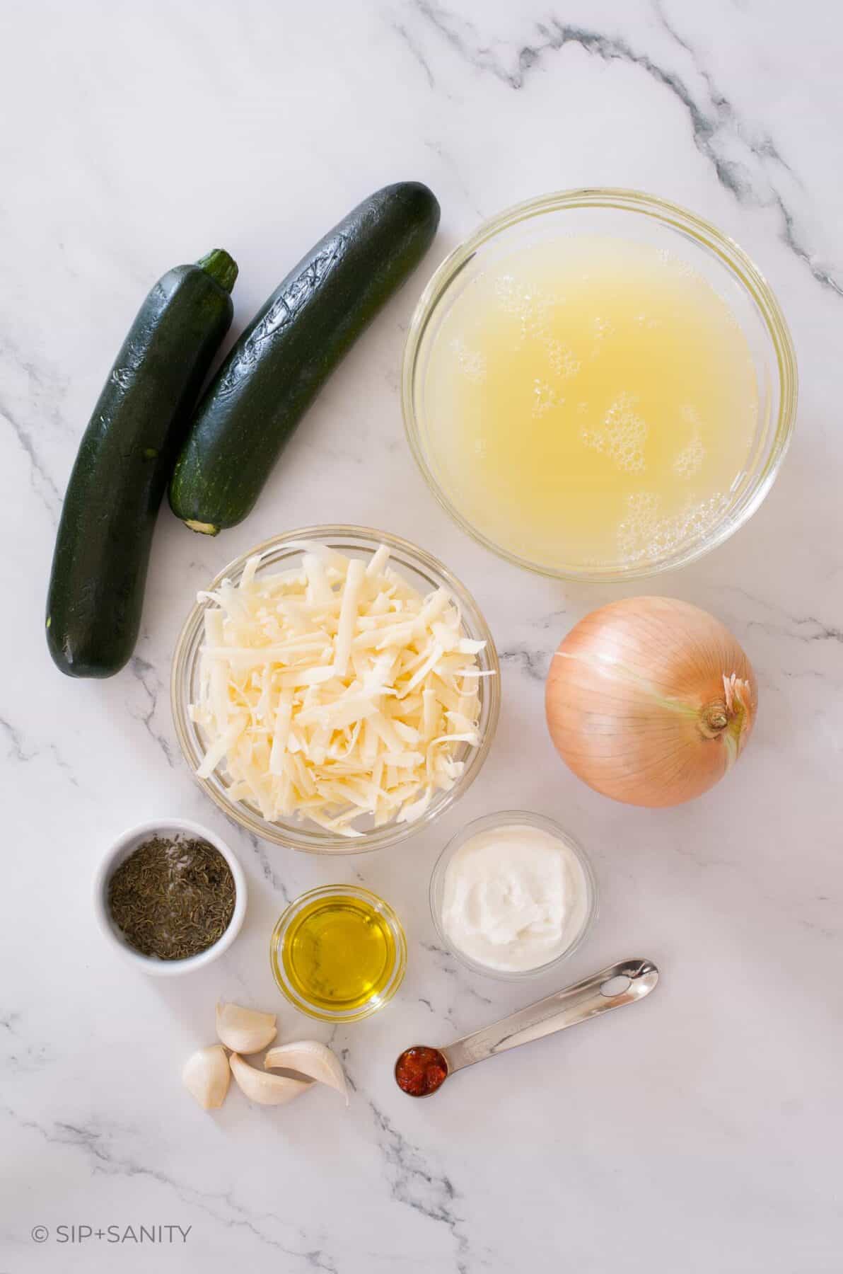 Raw ingredients for caramelized onion and zucchini egg white casserole.