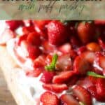 Pin image for giant strawberry shortcake dessert with puff pastry.