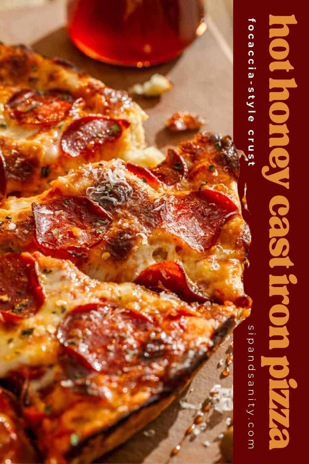 Hot honey pepperoni pizza on focaccia crust, sliced with grated cheese, text “hot honey cast iron pizza” at right.
